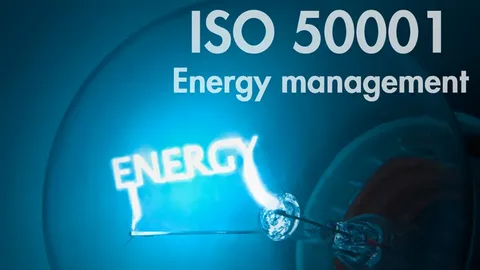 ISO 50001 energy management concept with glowing energy bulb
